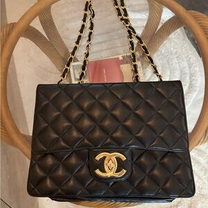 Black Quilted Shoulder Bag with Gold Hardware from the 1990’s vintage.